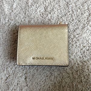 Michael Kors Saffiano leather gold folio wallet.